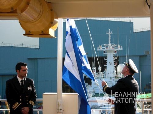 raising the Greek flag