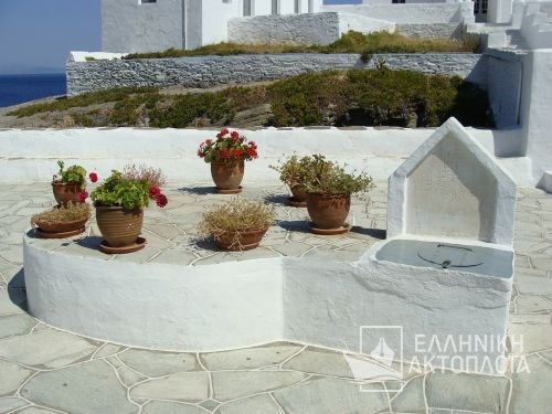 a traditional well at the front yard of chrisopigi church (sifnos)